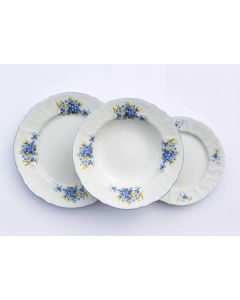 Dekor Deluxe 18 delni set krožnikov bele barve iz vrhunskega porcelana s poslikavo s spominčicami.