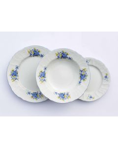 Dekor Deluxe 18 delni set krožnikov bele barve iz vrhunskega porcelana s poslikavo s spominčicami.