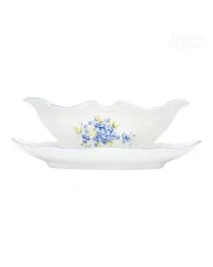 Dekor Deluxe omačnica bele barve iz vrhunskega porcelana z nežno poslikavo s spominčicami.